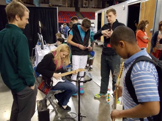 I'm glad Jen brought guitars--that was a definite draw for our arts booth. Minneapolis musician and former Mankato resident Matt Marka (left) provided some good advice to students.