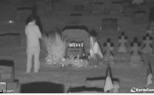This couple was visiting Andy Warhol's grave at 9 p.m. Saturday, Sept. 14. They spent several minutes at the grave and took many photos. When the walked into the camera frame while I was watching, it scared the crap out of me!