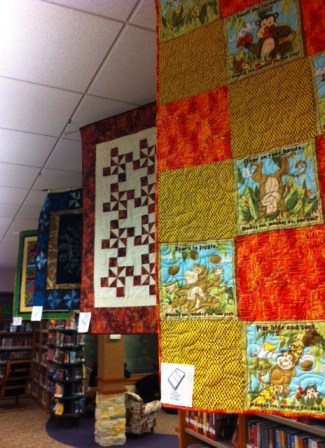 Quilts of all sizes abounded in the library. Each quilt related to a book. The variety of quilts and skill of the quilters amazed me.