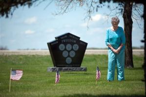 Photo from the Associated Press (Jesse Trelstad). Lillian Johnson visits relatives buried at the Lower Wild Rice and Red River Cemetery near Wild Rice, N.D.