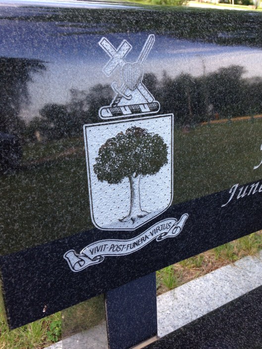 A detail shot of the above bench. The inscription is Latin for "virtue over death."