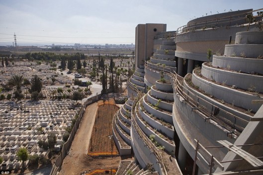 Kind of looks like a parking ramp, doesn't it? How they are solving the lack of cemetery space in Israel. This is in Yarkon Cemetery outside of Tel Aviv. Photo courtesy of the Associated Press.