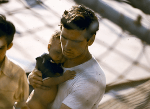 A soldier holds a Vietnamese baby aboard the USS Kirk. The caption on the PBS website says that one woman, evacuated while very pregnant, later gave her child the middle of "Kirk." Photo by Hugh Doyle from the PBS website. http://www.pbs.org/wgbh/americanexperience/features/photo-gallery/lastdays/ 