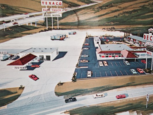 A postcard of a truck stop! It's the Deck Plaza at I-80 and Highway 82 in Geneseo, Illinois. The back says it has "complete modern interstate facilities."